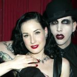 Dita Von Teese performs a strip tease