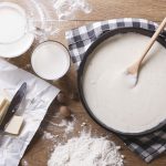 bechamel sauce in a pan and ingredients horizontal top view